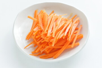 sliced carrot on dish for prepared food ingredient