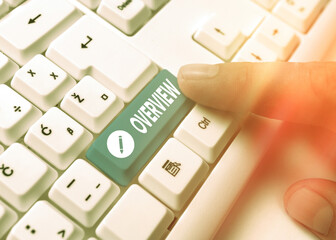 Conceptual hand writing showing Overview. Concept meaning description of facts findings and objectives to give a general view White pc keyboard with empty note paper above white key copy space