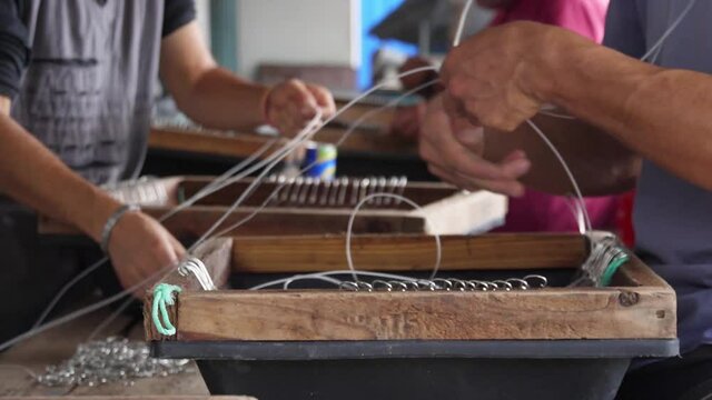 fishermen preparing fishing hooks slow motion