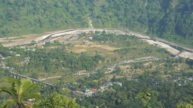 Footage of Joldhaka river flowing through India Bhutan international border at Jhalong, Dooars - West Bengal , India. River dividing two countries. Shot from Indian side.