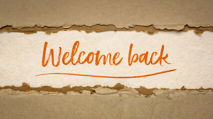 Welcome back handwriting on na handmade paper, business reopening concept, web banner