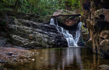 A magic time in the rainforest. Several small falls dropping from mossy rocks.  The Stoney Creek, Kamerunga, Cairns, Far North Queensland, Australia. 