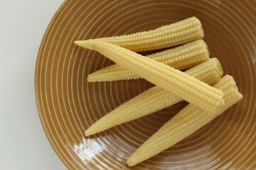 baby corn on dish with copy space