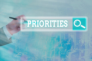 Handwriting text writing Priorities. Conceptual photo more important is the fact or state of being...