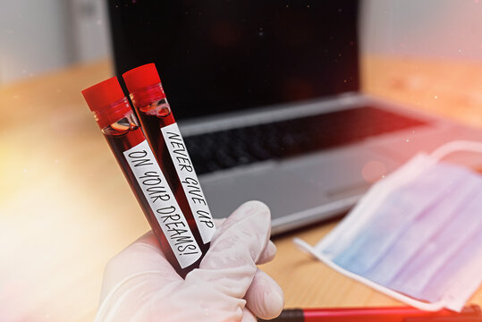 Writing note showing Never Give Up On Your Dreams. Business concept for Believing in yourself Walking the walk Blood sample vial lastest technology ready for examination