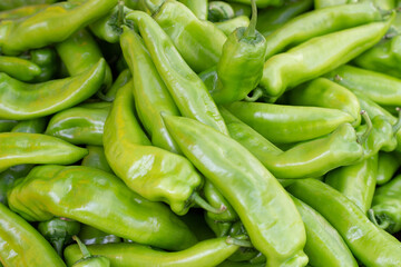 Large amount of green chili peppers, natural background, top view