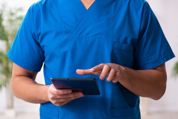 Young male doctor in telemedicine concept