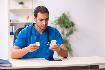 Young male doctor in telemedicine concept