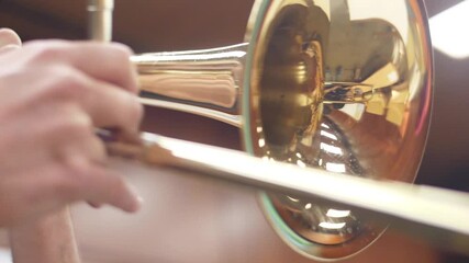 orchestra musician playing trombone slow motion