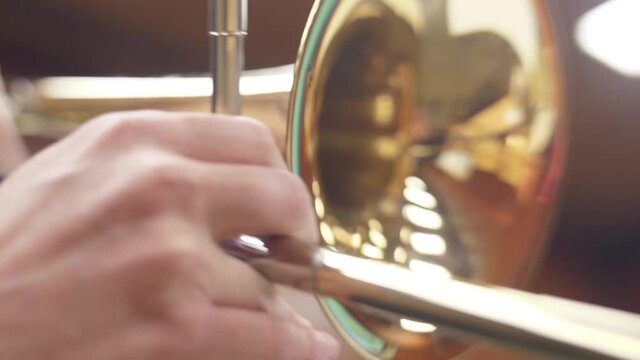 orchestra musician playing trombone slow motion