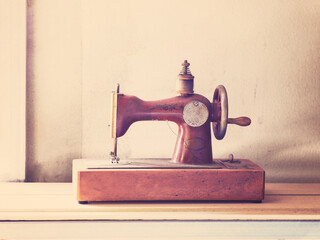 Rusty vintage sewing machine on wooden table