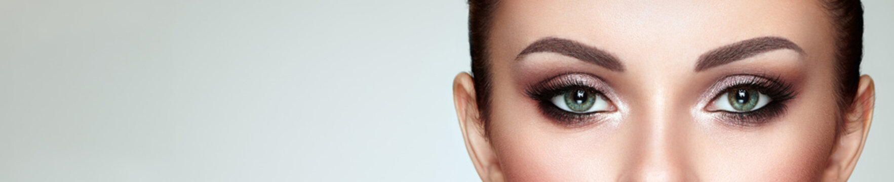 Female Eye with Extreme Long False Eyelashes. Eyelash Extensions. Makeup, Cosmetics, Beauty. Close up, Macro