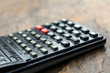 a wet scientific calculator  isolated on stone background