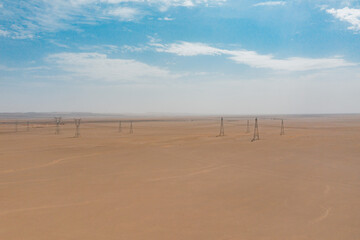 Fototapeta na wymiar sand dunes in the desert and blue sky
