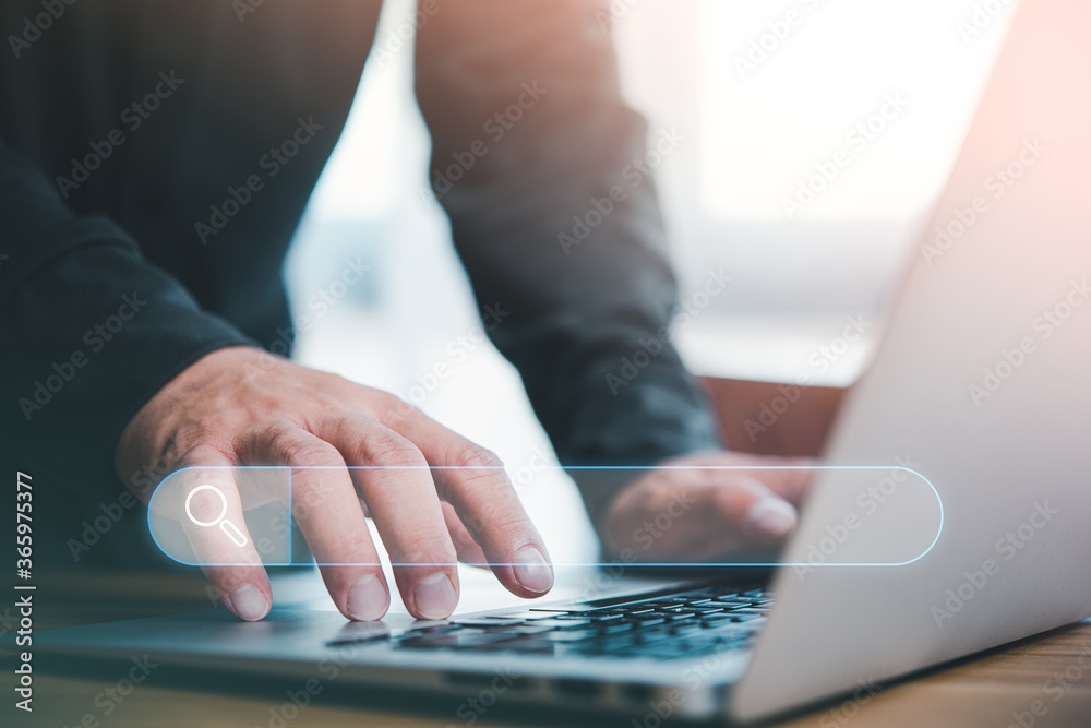 Leinwandbilder Data Search Technology Search Engine Optimization. man's hands are using a computer notebook to Searching for information.Using Search Console with your website.