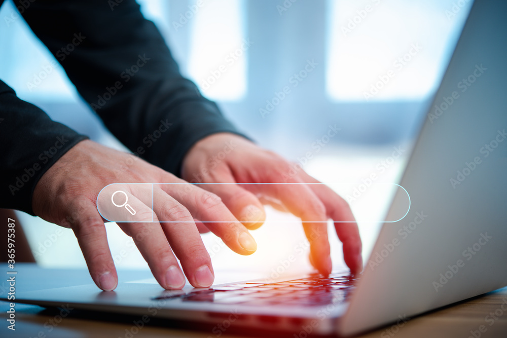 Leinwandbilder Data Search Technology Search Engine Optimization. man's hands are using a computer notebook to Searching for information.Using Search Console with your website.