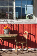 pumkins bucket on wooden table in fall