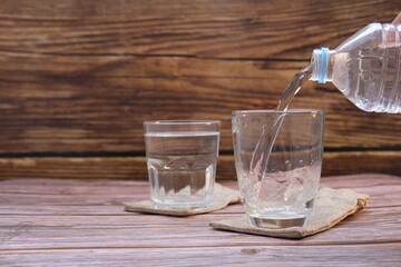 glass of water on wooden table