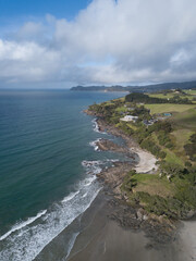 Aerial photo of small waves breaking. Taken off the coast of a small surf town in beautiful New Zealand. 