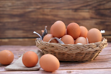 Close up chicken egg on wooden table background and space for text 