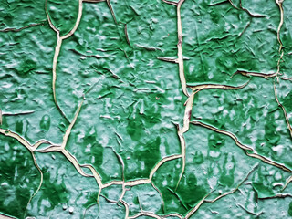 Old cracked green paint. Background texture closeup.
