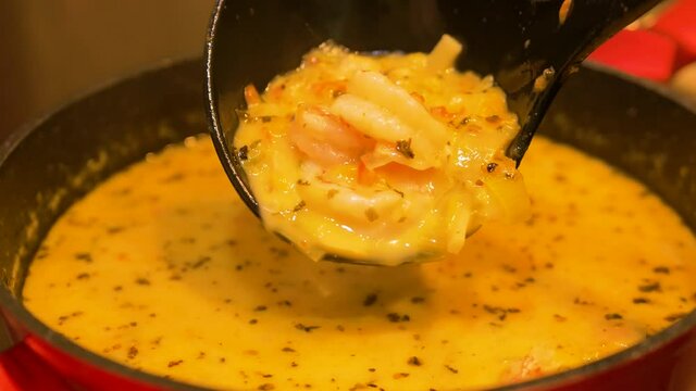 Steamy thick fish soup curry blend with atlantic prawn chunks