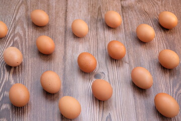 Eggs on wooden table background and space for text 