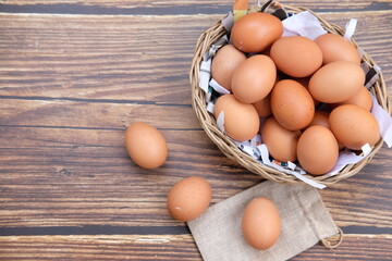 Eggs on wooden table background and space for text 