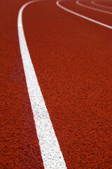 Red stadium running track closeup