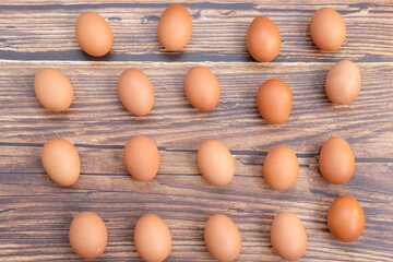 Close up chicken egg on wooden table background and space for text 