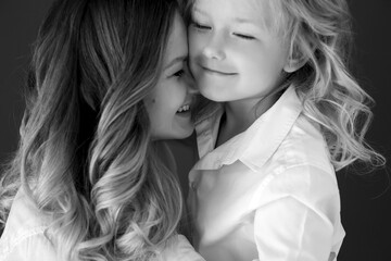 Mother child black white. Woman with child black and white photo. High quality photo