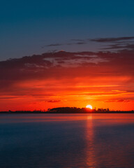 Sunset behind island silhouette 