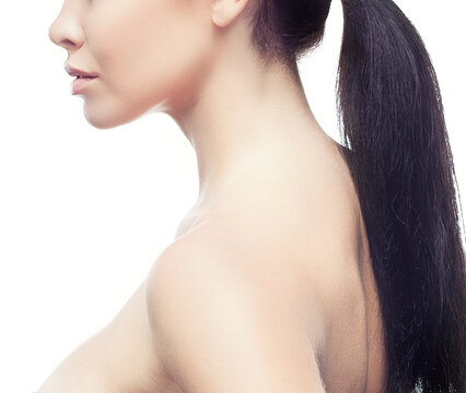Beauty partial portrait, young woman, lips, neck, shoulder, breast, perect skin, black hair, pony tale