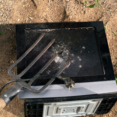 Old computer display and pitchfork