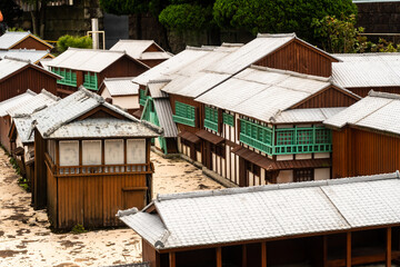 Fototapeta na wymiar Nagasaki, Japan, 03/11/19. Scale model of a Dutch trading post on display in Dejima, former artificial island in the harbor in Nagasaki, close-up view of wooden old buildings. O