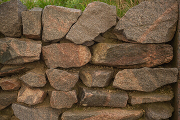 Background, texture, wall of stone granite blocks