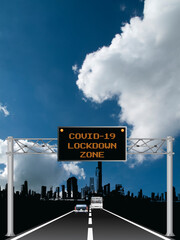Roadway overhead digital gantry sign with COVID 19 Coronavirus lockdown zone message set against a blue cloudy sky 