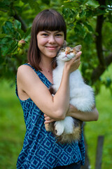 Girl with her purebreed cat outdoor