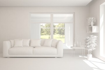 Fototapeta premium White living room with sofa and summer landscape in window. Scandinavian interior design. 3D illustration