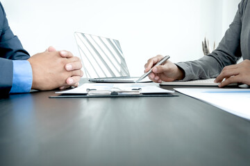 Fototapeta premium Two business leaders talk about charts, financial graphs showing results are analyzing and calculating planning strategies, business success building processes