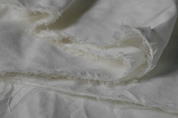 Texture of Crumpled White Calico Fabric.