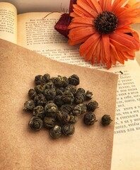 Green tea leaves and flowers