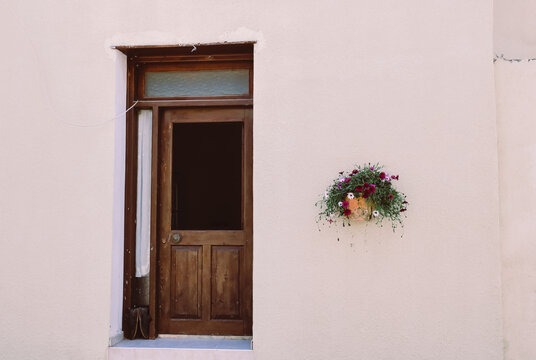 Wooden Door On A Light Pink Wall