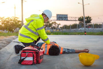 Accident at work of construction labor people, Basic First aid and CPR Training at outdoor. Heat...