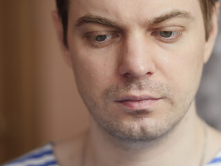 Obraz premium Portrait of pensive man with short hair and no retouch.