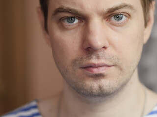 Portrait of pensive man with short hair and no retouch.