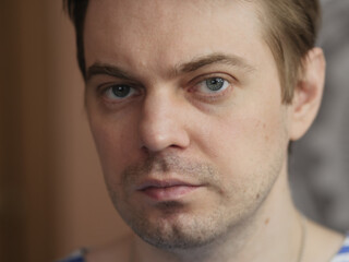 Portrait of pensive man with short hair and no retouch.