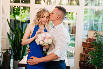 pair of lovers. girl with bouquet of flowers donated in honor of engagement.