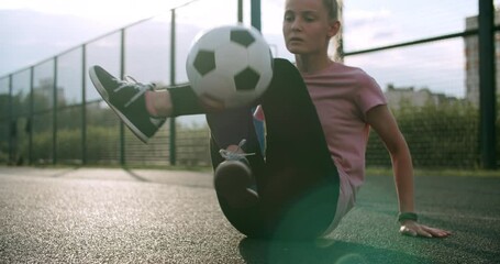Girl practicing soccer skills and tricks