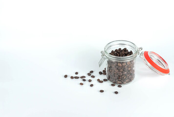glass bottle with coffee beans isolated on white background.